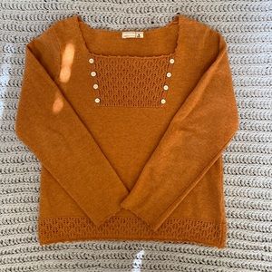 Stylish sweater in burnt orange color